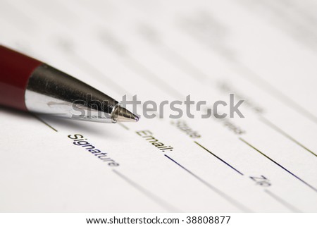 Pen point on the document