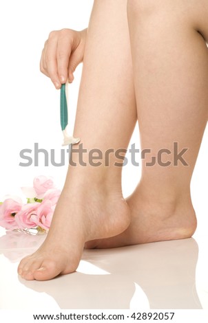 stock photo Girl shaving her legs Save to a lightbox Please Login