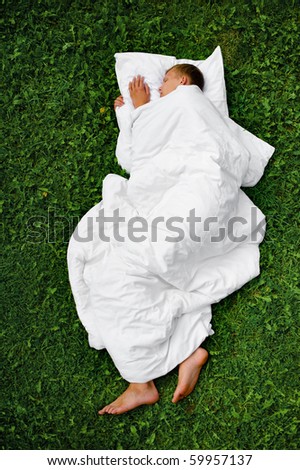 Sleeping man on a grass