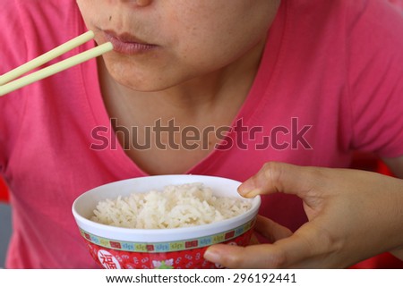 woman enjoy eating rice
