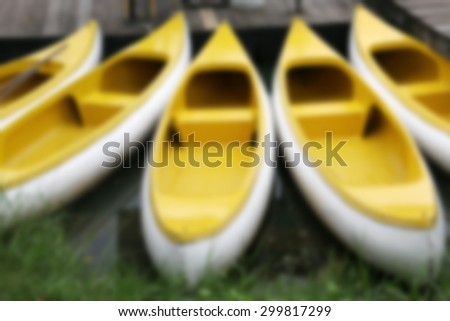Yellow boat on a river ,blurry background