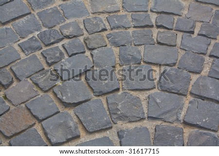 Stone blocks. The ancient road from stone blocks, is laid out by drawing.