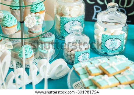 Candy bar on wedding ceremony with a lot of different candies and beverages