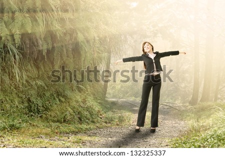 Business woman relax in forest, concept of freedom and environment and nature.