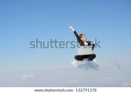 Business woman sit on cloud and use laptop over sky.