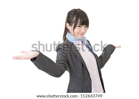 Close-up portrait of cheerful young asian business woman shrugging. Isolated on the white background.