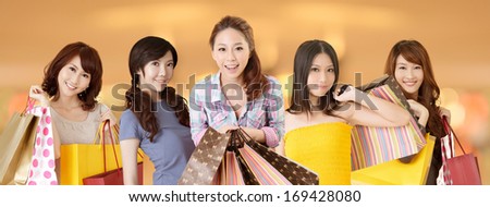 Happy smiling Asian shopping women on white background.