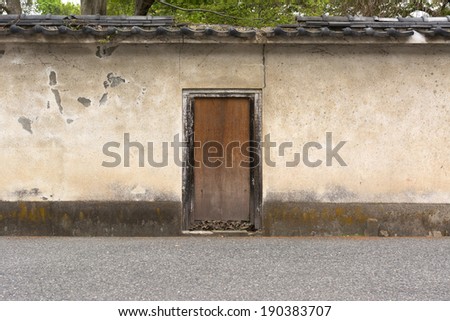 Japanese style wooden door and old wall in Kyoto with nobody, Japan, Asia.