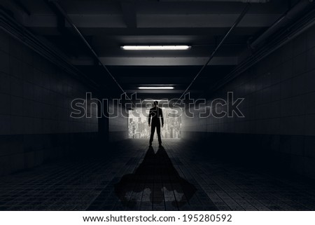 Concept of challenge, young business man standing and his shadow show the confidence or strength.