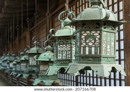 Japanese style bronze lantern hanging up in the shrine of  Kasuga Taisha in Nara, Japan.