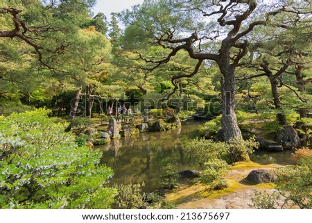 KYOTO, JAPAN - APRIL 26th  : Pond and pine trees in the Japanese garden of Ginkakuji Temple, Kyoto, Japan on 26th April 2014.