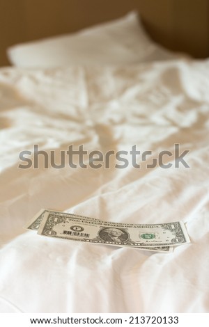 Tips at the bed for the housekeeper in hotel.