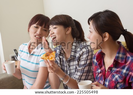 Asian women chat, close-up indoor portrait.