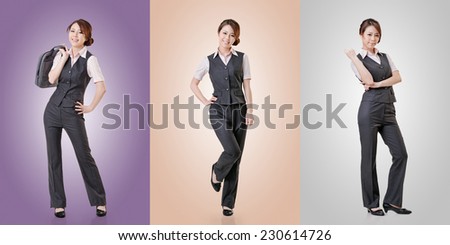 Asian business woman standing against studio background, full length portrait in a set.