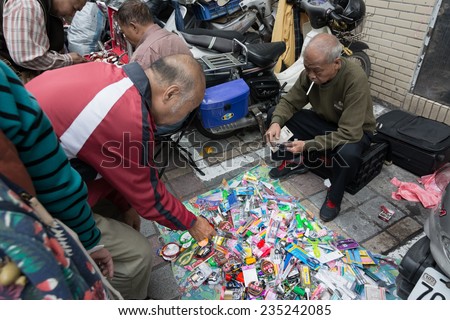 TAIPEI, TAIWAN - November 16th : Street vendor sell various of daily necessities near Longshan Temple, Taipei, Taiwan on November 16th, 2014.