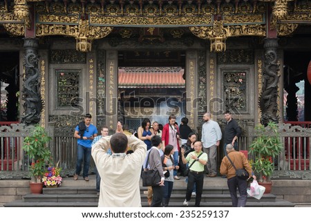 TAIPEI, TAIWAN - November 16th : The believer worship hands held high in Longshan Temple , Taiwan on November 16th, 2014.