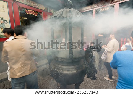 TAIPEI, TAIWAN - November 16th : The incense burner with smoky in Longshan Temple, Taiwan on November 16th, 2014.