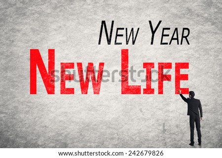 Asian business man write words on wall, New Year New Life