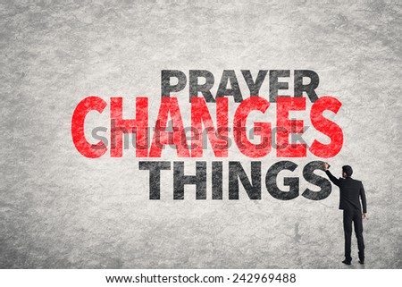 Asian businessman write text on wall, Prayer Changes Things