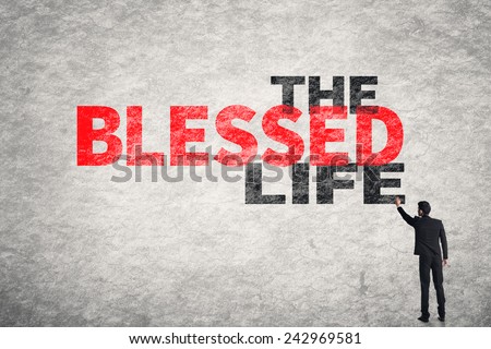 Asian businessman write text on wall, The Blessed Life