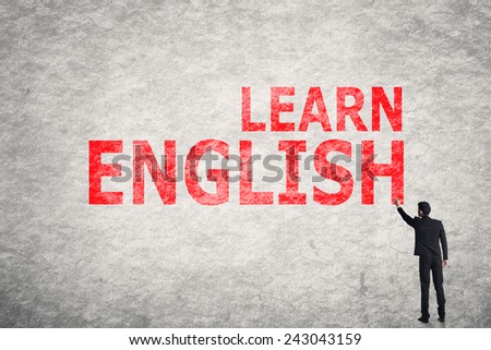 Asian businessman write text on wall, Learn English