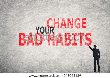 Asian businessman write text on wall, Change Your Bad Habits