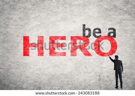 Asian businessman write text on wall, Be a Hero