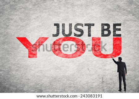 Asian businessman write text on wall, Just Be You