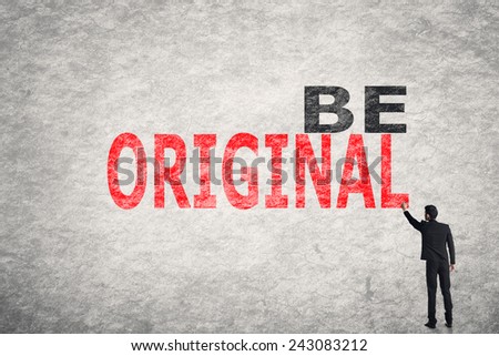 Asian businessman write text on wall, Be Original