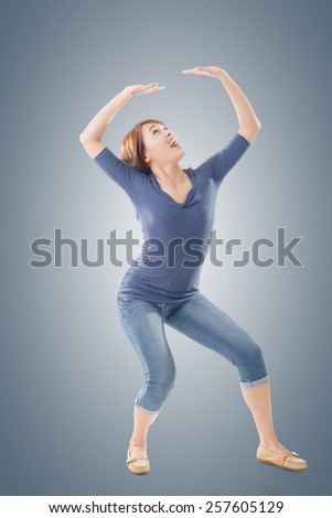 Full length portrait of Asian woman under stress, isolated on studio background.