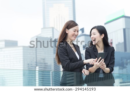 Asian business women talking to each other in Hong Kong, Asia.