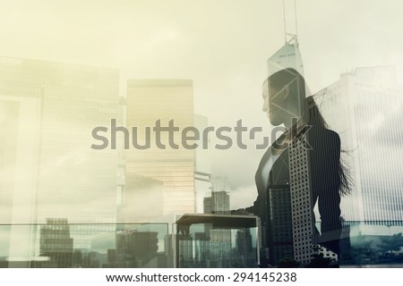 Silhouette of businesswoman stand and look far away in Hong Kong, Asia. Double exposure.