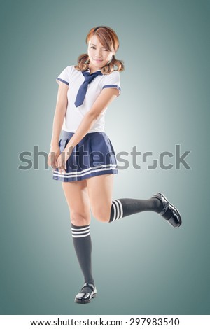 Japanese style school girl in sailor suit, full length portrait.
