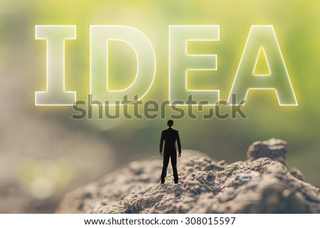 Concept of plan with a person stand in the outdoor and looking up the text over the sky in nature background.