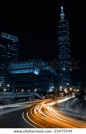 Taipei traffic and car light with famous landmark - 101 building in the night, Taiwan.