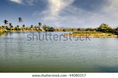 Rural scenic of lake and grassland in tropical area.