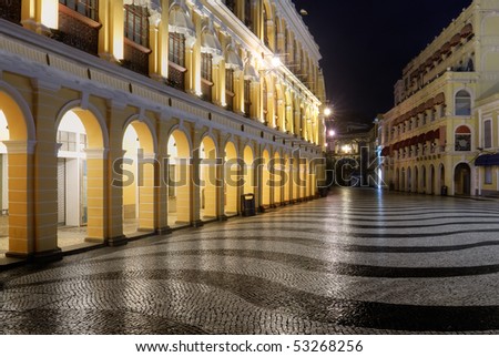 Macao landmark - Senado Square with European buildings and elegant wavy patterns in night.
