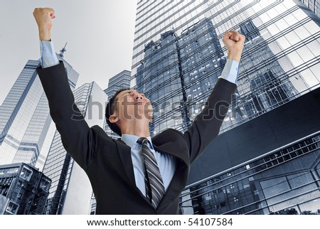 Businessman struggle in modern city with pain expression and fist up.