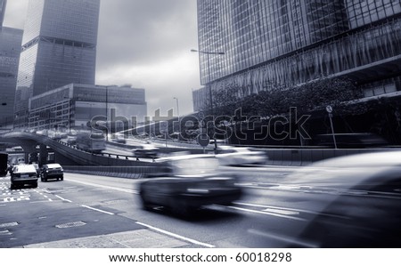 Modern city with busy cars and business buildings and skyscrapers in Hong Kong, China.