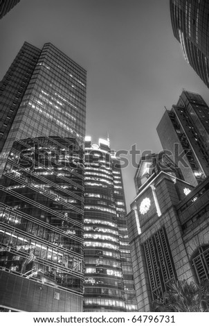 Business architecture, buildings, skyscrapers at night in black and white.