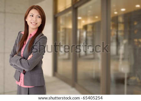 Young attractive business woman with smiling expression.