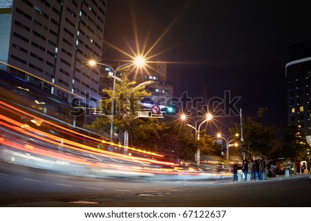 City night scene with cars motion blurred in Taipei, Taiwan, Asia.