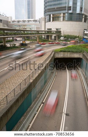 Business center scenery of cars on road with modern building in daytime in Hong Kong, Asia.