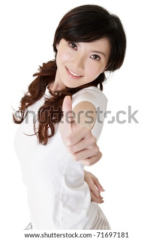 Young beautiful woman of Chinese giving you excellent gesture.