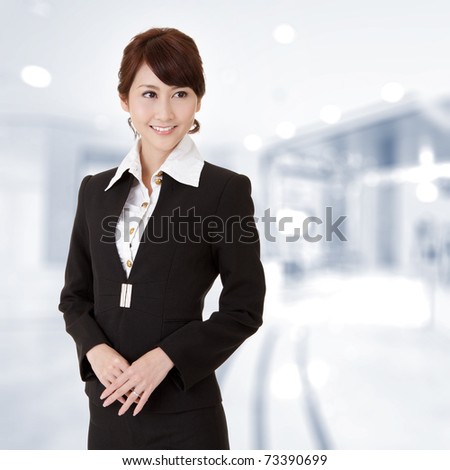 Successful young executive woman smiling, closeup portrait in office.