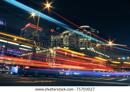 Colorful city night with lights of cars motion blurred in Taipei, Taiwan, Asia.
