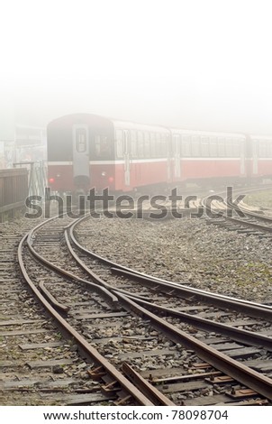 Train and railway in mist in Alishan National Scenic Area, Taiwan, Asia.