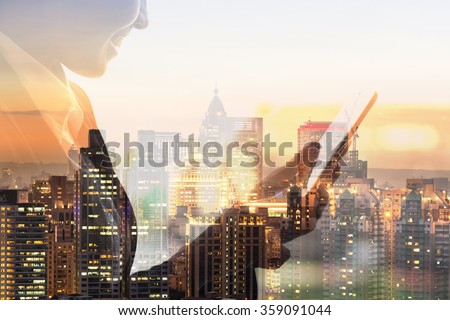 Portrait of Asian business woman using tablet in a room, concept of technology or communication.