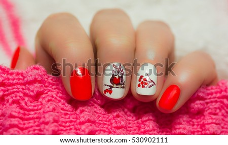 Woman with beautiful manicured blue fingernails gracefully crossing her hands to display them to the viewer, glamour and beauty concept. new year. on mountain ash