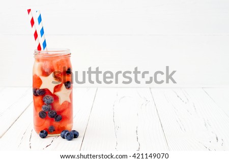 Red, White and Blue lemonade or sangria. Patriotic drink cocktail with watermelon, blueberry and apple for 4th of July party. Fruit infused water